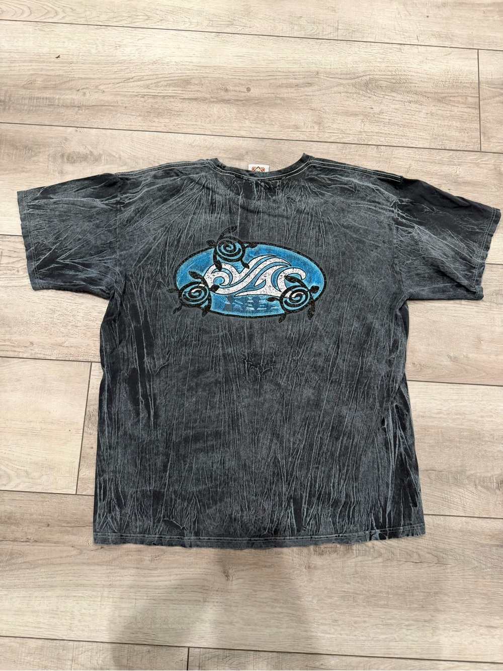 Black Short-Sleeve Graphic Tee with Blue Wave Emblem